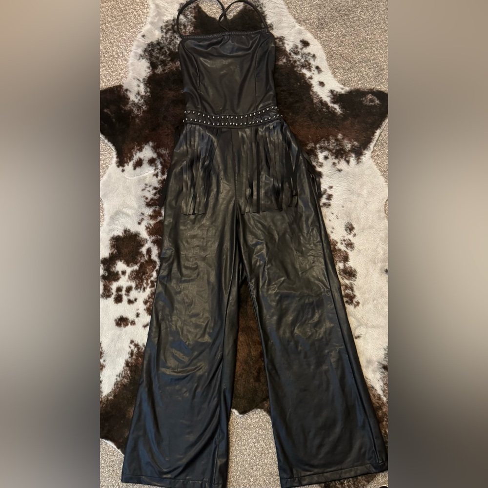 Faux leather jumpsuit with fringe waist